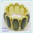 China Newest oval gold plated alloy dark yellow resin stone bangle bracelets manufacturer