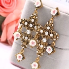 China Personality cross flower earrings European and American big star street shot with the same paragraph jewelry gold drop earrings manufacturer