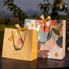 China CMYK printing paper bag shopping packaging bag paper gift carrier paper bag jewelry packaging manufacturer