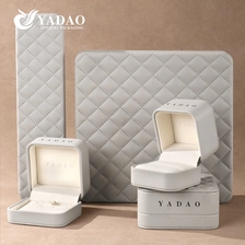 中国 ハイエンドグレーグリッドレザージュエリーボックス、カスタムロゴ、多機能ジュエリー収納ボックス メーカー