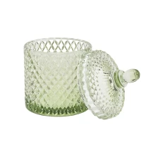 China Hot sales China luxury empty embossed glass large candle vessel with lid manufacturer