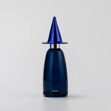 China Custom Color 50ml Blue Glass Perfume Bottle with Creative Cap manufacturer