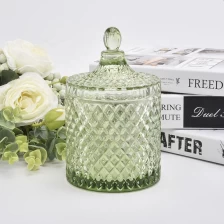 China luxury embossed glass candle jar with lid manufacturer