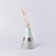 China Vintage silver Triangle oil essential reed diffuser ceramic bottle manufacturer