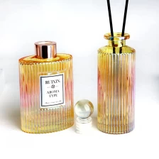 China Electroplated Ribbed Pillar Shaped ribbed yellow Glass Diffuser Bottles with Caps manufacturer