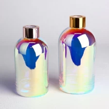 China Electroplated Round Glass Diffuser Bottles with Caps and Screw Neck manufacturer