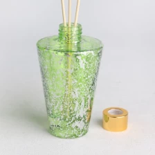 China transparent green electroplated laser fleck finished glass diffuser bottle manufacturer