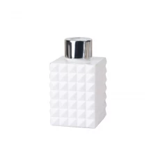 China 100ml 3.5oz geo cut square opaque glossy white glass diffuser bottle with lid manufacturer