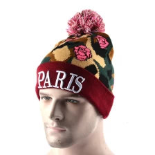 China 3d embroidery winter caps pom pom beanies manufacturer