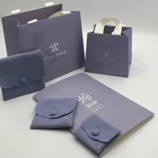 China 210gsm CMYK printing paper bag shopping paper bag with ribbon handle gift packaging bag manufacturer