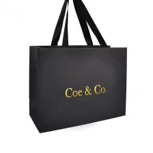 China CMKY Fancy paper bag big size for clothes gift packaging hot stamping logo brand promotion manufacturer