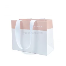 China CMYK printing custom size/color/logo  shopping/gift/jewelry packaging paper bag with ribbon handle manufacturer