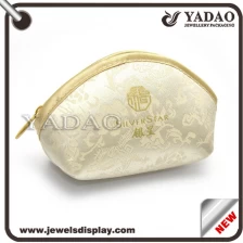 China Chinese wholesale cheap small elegant silk jewelry pouch for jewelry packaging with zipper and beautiful pattern manufacturer