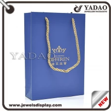 China Custom MOQ 1000 High quality blue paper packing bags with gold hot stamping logo and gold fiber cord for shop store and shopping bags gift hand bags manufacturer