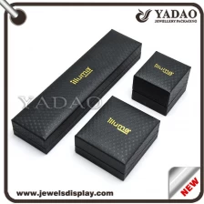 China Custom black PU leather packing boxes with gold hot stamping logo for jewelry and gift storage and party favors jewellery case manufacturer