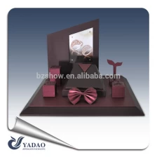 China Elegant color luxury leather covered wooden jewelry display window manufacturer