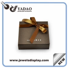 China Elegant custom jewelry packing paper box with screen logo and gold color ribbon manufacturer