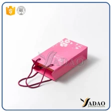 China High quality Accept Custom Order kraft shopping Bag Recyclable Feature and Hand Length Handle Sealing & Handle paper carrier bag manufacturer