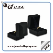 China Luxury Led light jewelry boxes plastic with rubber finish ring box jewelry display earring box pendant boxes bangle box and bracelet display box manufacturer