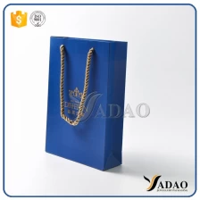 China Nicety strong hard paper material wholesale customized suitable price paper bags/shopping bags manufacturer