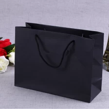 China OEM/ODM Production Brand Name Luxury Design Printing Folded Brown Craft Custom Kraft Paper Shopping Bag With Rope Handle manufacturer