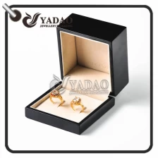 China Personalized glossy wooden ring box suitable for packing couple rings engagement rings and wedding rings manufacturer