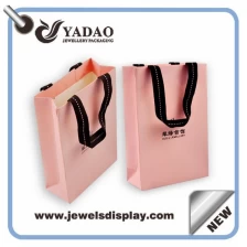 China Wholesale China factory custom logo pink shopping bags for jewelry and Cosmetic packing pink paper handbag manufacturer