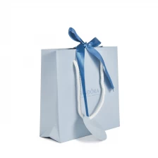 China Wholesale UV Paper Bag Gift Bag Shopping Craft Handbag with Ribbon Closure and Cotton Rope Handle manufacturer