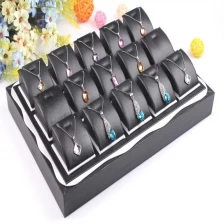China Wholesale custom elegant black PU leather jewelry display holders for shop counter and exhibition showcase leather pendant trays manufacturer