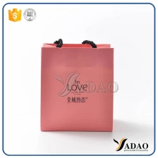 China Wholesale new design pink paper gift bag shopping craft handbag with free logo customize manufacturer