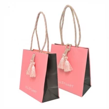 China Yadao customized Free logo printing paper bag shopping packaging with rope handle and tassel decoration manufacturer