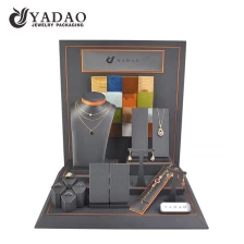 China charming window jewelry display set jewelry counter jewelry display wooden display props wrapped by pu leather on slanted boards manufacturer