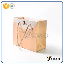 Cina colore personalizzato formato MOQ finitura lucida OEM / ODM all'ingrosso realizzata con sacchetti di carta per shopping / regalo / imballaggio in Yadao produttore