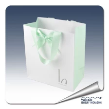 ประเทศจีน customize unique ribbon handle shopping bag jewelry packaging bag logo printing paper bag ผู้ผลิต