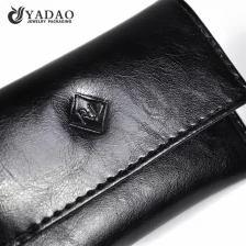 China genuine leather jewelry pouch bag gift packaging bag snap design gift bag embossed logo finish manufacturer