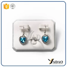 ประเทศจีน lacquer/Leather/velvet wholesale For exhibition and showcase display design OEM/ODM jewelry ring/wedding earring/jade/gem display stand frame material ผู้ผลิต
