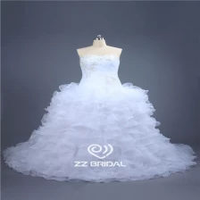 porcelana Últimas vestido de diseño con cuentas sin tirantes con volantes de organza pelota capas de boda del vestido de China fabricante