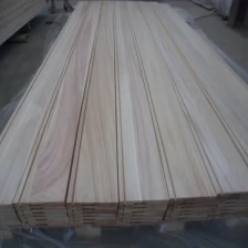 China paulownia edge glued board for wall panel with groove fabricante