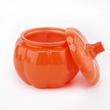 Chine Pot en forme de citrouille orange Halloween pour bougie en verre de bonbons avec couvercle en verre de citrouille fabricant