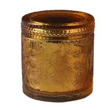 China Luxury Embossed Glass Candle Jar With Glass Lid For Wax Making manufacturer