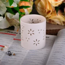 China Matte White Ceramic Tealight Candle Holder with Pierced Leaves Pattern manufacturer