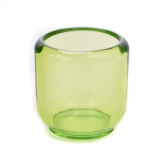 China Popular green transparent glass candle holder empty jars wholesale manufacturer