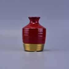 China Roter und goldfarbener Keramikkerzenhalter Hersteller