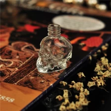 China skull shape glass perfume oil bottle 5ml manufacturer