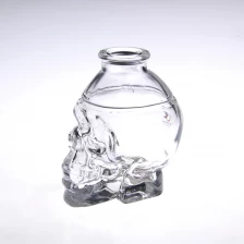 China Small skull head bottle perfume comestic glass container manufacturer