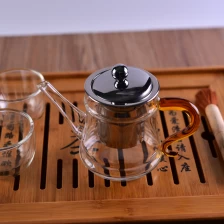 中国 批发促销透明玻璃茶壶黄色手柄带过滤器 制造商
