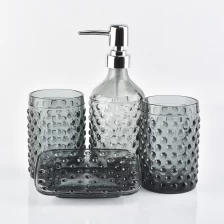 Cina bottiglie di vetro grigio fumoso, bicchieri, portasapone per il bagno in albergo produttore
