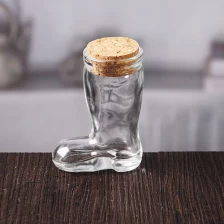 China Small transparent unique boot shaped glass bottle with cork lid manufacturer