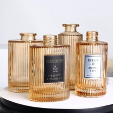 China Ribbed Round Amber Glass Diffuser Bottles with Caps manufacturer