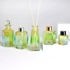 China Electroplated Prism Shaped Green Glass Diffuser Bottles with Caps manufacturer